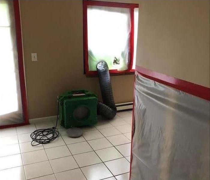 green air scrubber, flex duct thru poly-fit window, tile floor
