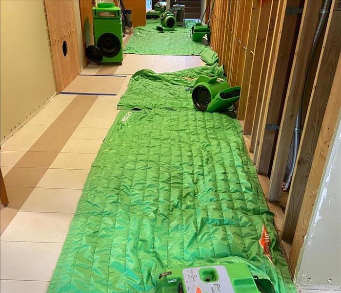 School hallway with SERVPRO drying equipment